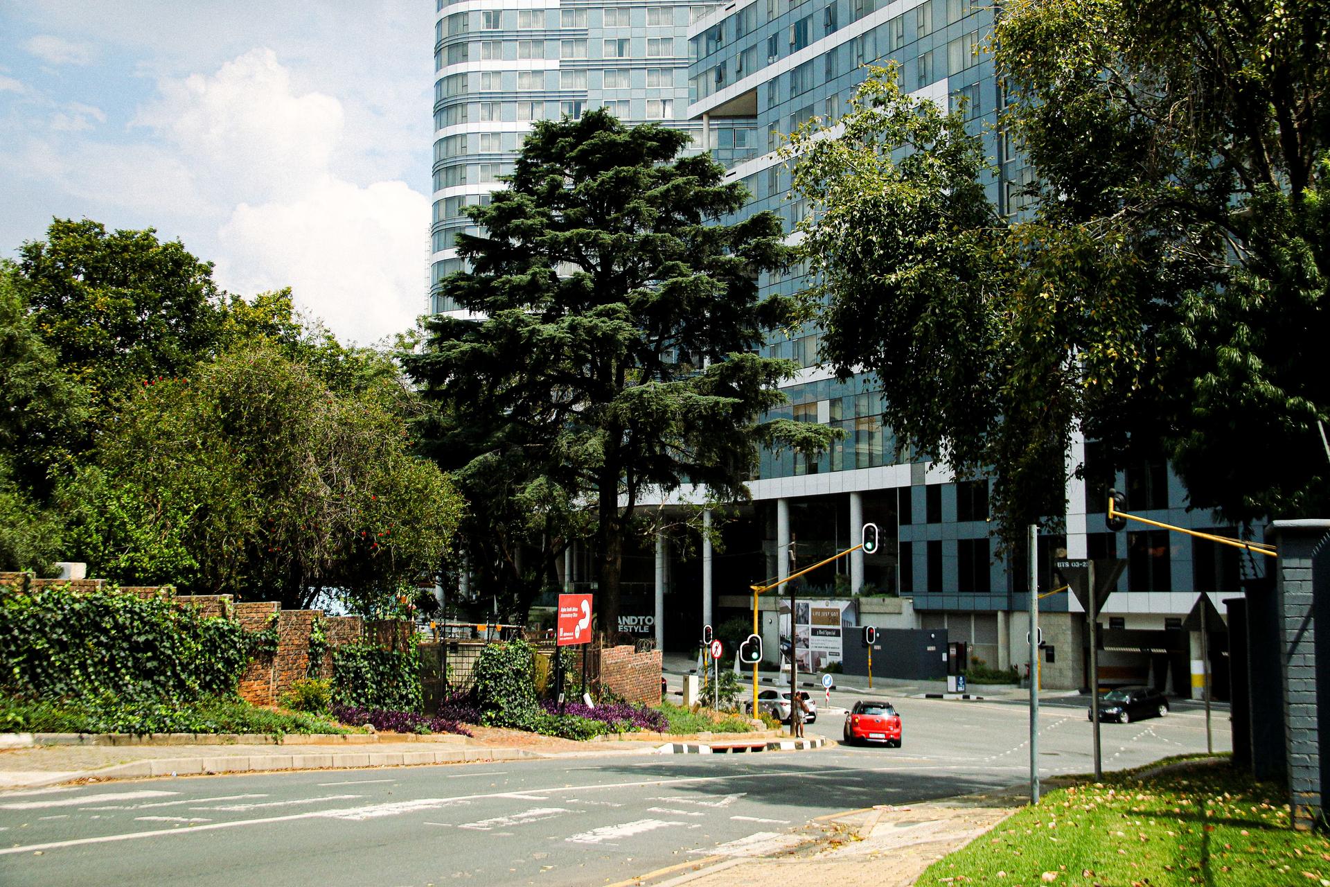Skyscrapers in the Sandton business district of Johannesburg, South Africa, under a clear daytime sky.