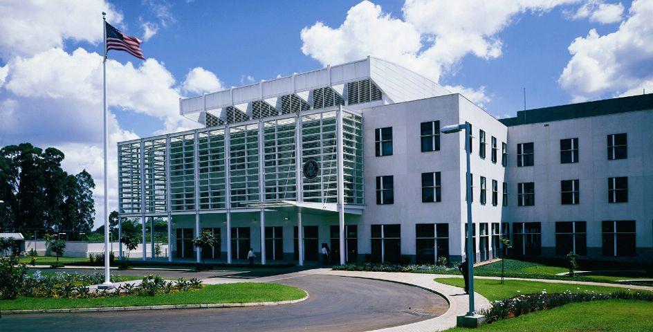 Exterior view of the United States Embassy compound in Nairobi, Kenya, showing the entrance area and surrounding security perimeter.